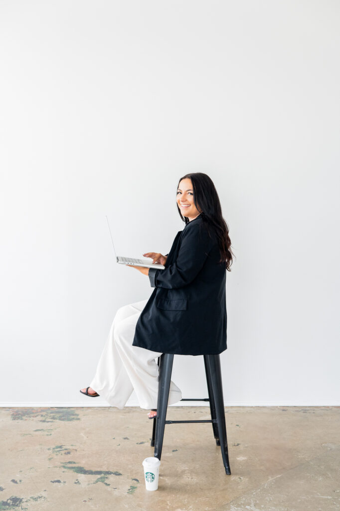 A Brand Session with a Social Media Manager Concord Brand Photographer Lady sitting on a stool with her laptop